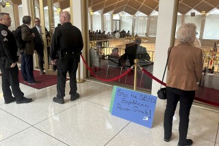 A placard expressing opposition to a Republican-penned measure being debated sits outside the North Carolina Senate gallery at a Legislative Building news conference in Raleigh, N.C., Wednesday, Nov. 20. 2024. (AP Photo/Gary D. Robertson)