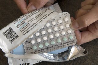 
              FILE - In this Aug. 26, 2016, file photo, a one-month dosage of hormonal birth control pills is displayed in Sacramento, Calif. A U.S. appeals court Thursday, Dec. 13, 2018, blocked rules by the Trump administration allowing more employers to opt out of providing women with no-cost birth control. (AP Photo/Rich Pedroncelli, File)
            