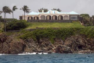 FILE - Jeffery Epstein's estate on Little Saint James Island in the U. S. Virgin Islands, July 9, 2019. A U.S. investor has bought two Caribbean islands, Great St. James and Little St. James islands, that were once owned by the late Jeffrey Epstein, a spokesman told The Associated Press on May 4, 2023. (AP Photo/Gianfranco Gaglione, File)
