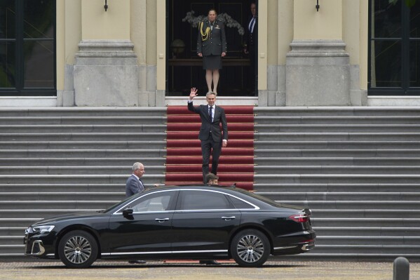 Dutch Prime Minister Dick Schoof waves after handing in the resignation of Geert Wilder's PVV party ministers to King Willem-Alexander at royal palace Huis ten Bosch in The Hague, Netherlands, Tuesday, June 3, 2025. (AP Photo/Peter Dejong)