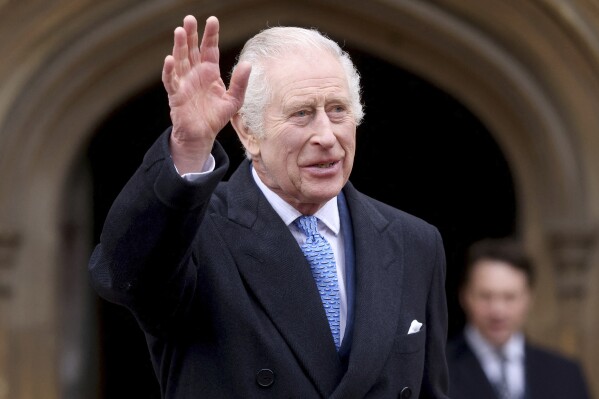 Britain's King Charles III waves as he leaves after attending the Easter Matins Service at St. George's Chapel, Windsor Castle, England, Sunday, March 31, 2024. (Hollie Adams/Pool Photo via AP)
