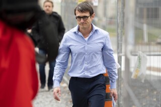 FILE = Cameron Ortis, a senior intelligence official at the RCMP, leaves the courthouse in Ottawa, Ontario, after being granted bail, Tuesday, Oct. 22, 2019. A judge Wednesday, Feb. 7, 2024, sentenced Ortis to 14 years in prison for breaching the country's secrets law. Ortis led the Royal Canadian Mounted Police’s Operations Research group, which assembles classified information on cybercriminals, terror cells and transnational criminal networks.(Justin Tang/The Canadian Press via AP)