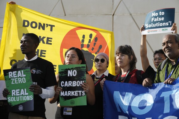 FILE - Activists participate in a demonstration at the COP28 U.N. Climate Summit, Dec. 8, 2023, in Dubai, United Arab Emirates. (AP Photo/Peter Dejong, File)