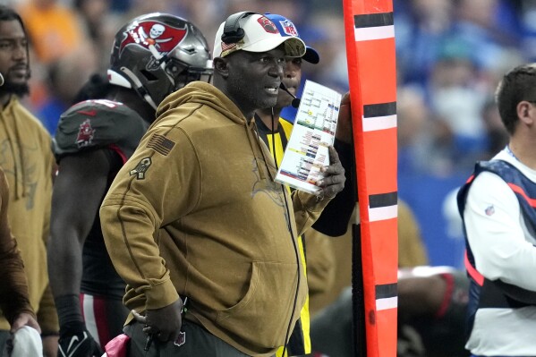 Tampa Bay Buccaneers head coach Todd Bowles stands on the sidelines during the second half of an NFL football game against the Indianapolis Colts Sunday, Nov. 26, 2023, in Indianapolis. (AP Photo/Michael Conroy)