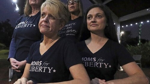 FILE - Moms for Liberty members, from left, Cheryl Bryant, Mishelle Minella, Kelly Shilson and Jessica Tillmann pose for a portrait at Reiter Park on Thursday, Nov. 18, 2021 in Longwood, Fla. Tillmann is the chair of the group's Seminole County chapter. (Chasity Maynard/Orlando Sentinel via AP, File)