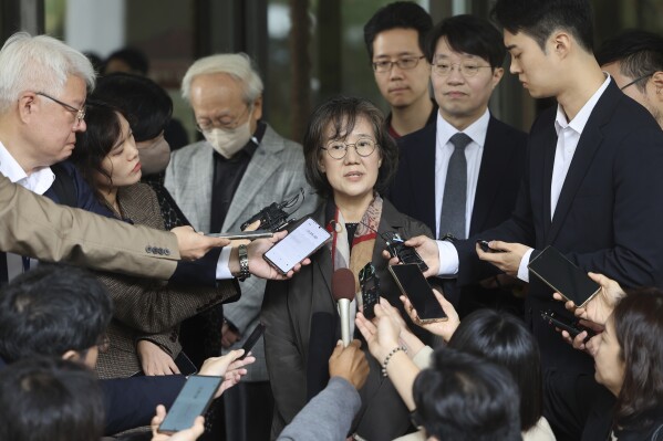 Professor Park Yu-ha answers reporters' questions outside the Supreme Court of Korea in Seoul, South Korea, Thursday, Oct. 26, 2023. (Park Dong-ju/Yonhap via AP)