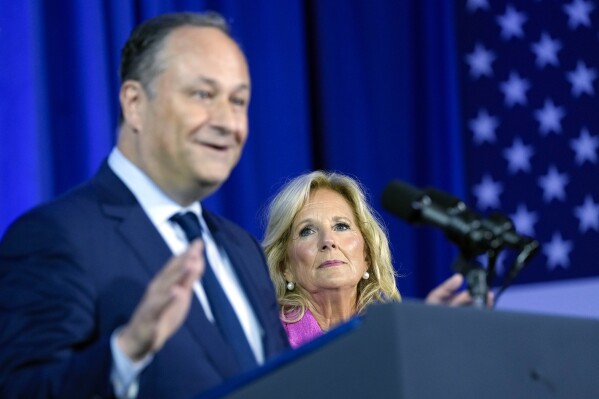 First lady Jill Biden listens as Doug Emhoff, husband of Vice President Kamala Harris, speaks during an event about reproductive rights in Washington, Friday, June 23, 2023. (AP Photo/Susan Walsh)