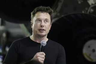 
              FILE - In this Sept. 17, 2018, file photo SpaceX founder and chief executive Elon Musk speaks after announcing Japanese billionaire Yusaku Maezawa as the first private passenger on a trip around the moon in Hawthorne, Calif. Tesla and its CEO Musk have agreed to pay a total of $40 million and make a series of concessions to settle a government lawsuit alleging Musk duped investors with misleading statements about a proposed buyout of the company. The Securities and Exchange Commission announced the settlement Saturday, Sept. 29, 2018, just two days after filing a case seeking to oust Musk as CEO. (AP Photo/Chris Carlson, File)
            