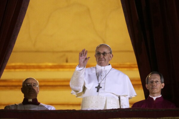 Pope Francis on the central balcony of St. Peter’s Basilica at the Vatican, March 13, 2013. (AP Photo/Gregorio Borgia)