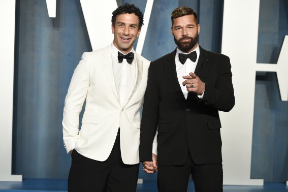 FILE - Jwan Yosef, left, and Ricky Martin appear at the Vanity Fair Oscar Party in Beverly Hills, Calif., on March 27, 2022. (Photo by Evan Agostini/Invision/AP, File)