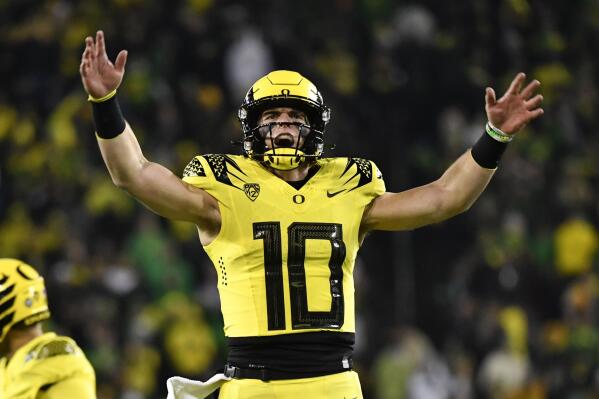 Oregon quarterback Bo Nix (10) celebrates a touchdown against Washington during the second half of an NCAA college football game Saturday, Nov. 12, 2022, in Eugene, Ore. (AP Photo/Andy Nelson)
