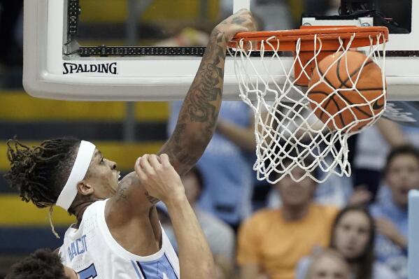 North Carolina forward Armando Bacot dunks against Furman during the second half of an NCAA college basketball game in Chapel Hill, N.C., Tuesday, Dec. 14, 2021. (AP Photo/Gerry Broome)