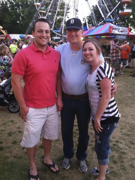 This photo provided by the family shows from left, David Bennett Jr., David Bennett Sr., and Nicole (Bennett) McCray at a carnival in 2014. In a medical first, doctors transplanted a pig heart into Bennett Sr., in a last-ditch effort to save his life and the hospital said Monday, Jan. 10, 2022 that he's doing well three days after the highly experimental surgery. (Courtesy David Bennett Jr. via AP)