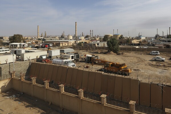FILE - An oil refinery is seen in the city of Beiji, some 250 kilometers (155 miles) north of Baghdad, Iraq, on Dec. 8, 2014. Iraq's prime minister announced Friday Feb. 23, 2024 the reopening of the Beiji refinery, the country's largest, which had been shut down for a decade after being damaged in the battle against the Islamic State extremist group. (AP Photo/Hadi Mizban, File)