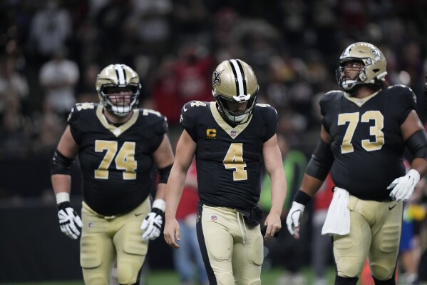 New Orleans Saints quarterback Derek Carr (4) reacts after fumbling the ball in the second half of an NFL football game against the Tampa Bay Buccaneers, in New Orleans, Sunday, Oct. 1, 2023. (AP Photo/Gerald Herbert)