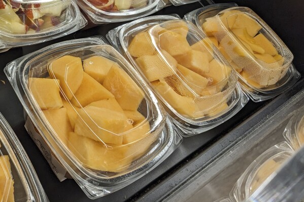 Cut cantaloupe is displayed for sale at a supermarket in Philadelphia on Sunday, Dec. 3, 2023. On Thursday, Dec. 7, 2023, U.S. and Canadian officials reported additional deaths and illnesses in a salmonella outbreak tied to tainted cantaloupe. (AP Photo/Jonathan Poet)