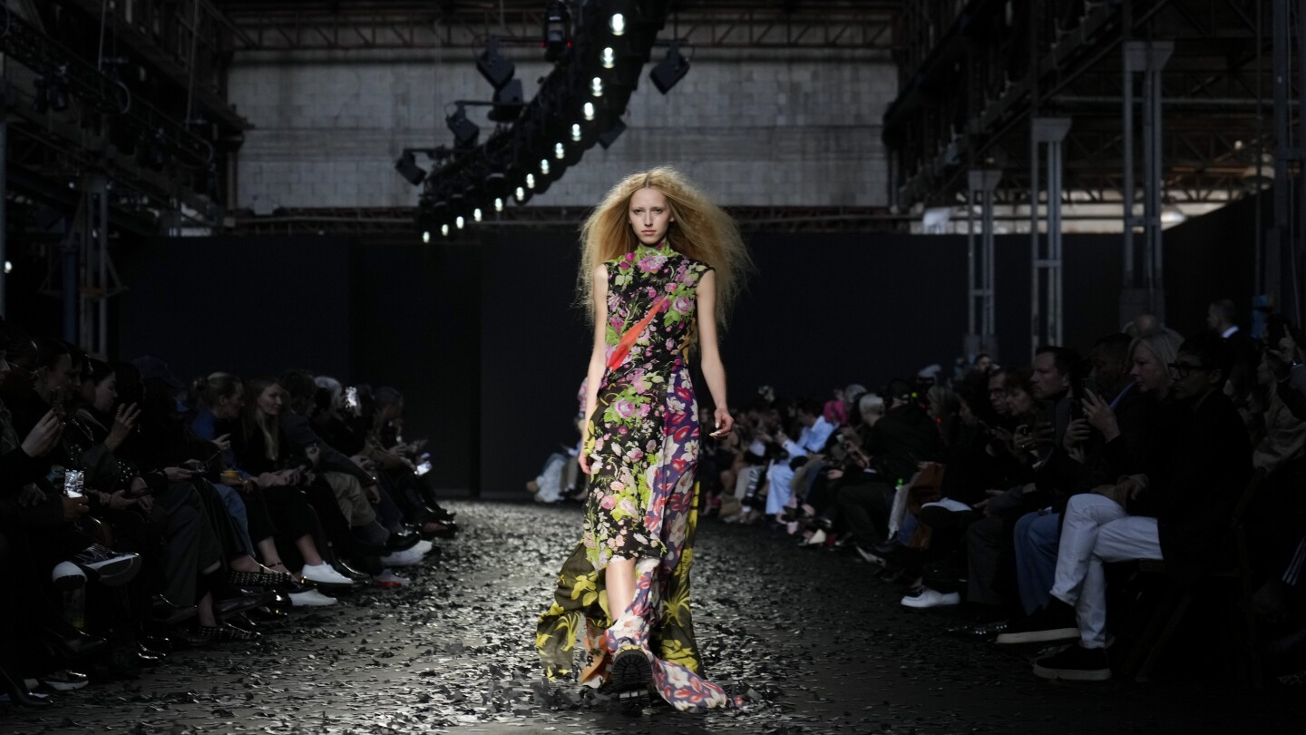 Moschino underlines playful collection with wake-up calls: Save our Sphere and Don't be Silent