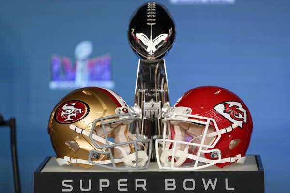 The trophy and helmets are on display ahead of NFL football commissioner Roger Goodell Super Bowl 58 news conference, Monday, Feb. 5, 2024, in Las Vegas. The San Francisco 49ers face the Kansas City Chiefs in Super Bowl 58 on Sunday. (AP Photo/Matt York)
