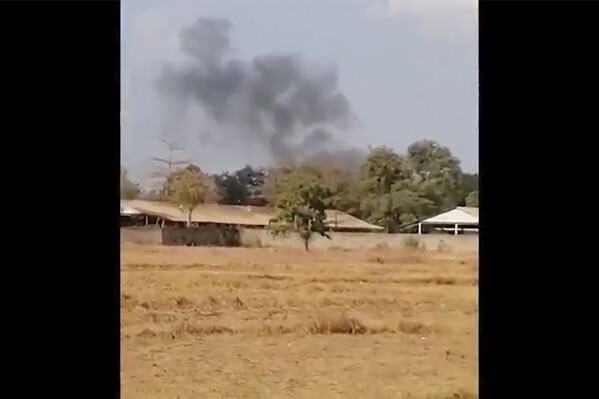 FILE - In this image from a video, smoke rises above a distant base, seen from Chbar Mon district in Kompong Speu province, Cambodia on April 27, 2024. A huge explosion in southwestern Cambodia over the weekend that killed 20 soldiers at an army base appears to have been an accident caused by mishandling of ammunition by troops, a senior military official said Tuesday, April 30. (Chim Sothea via AP, File)