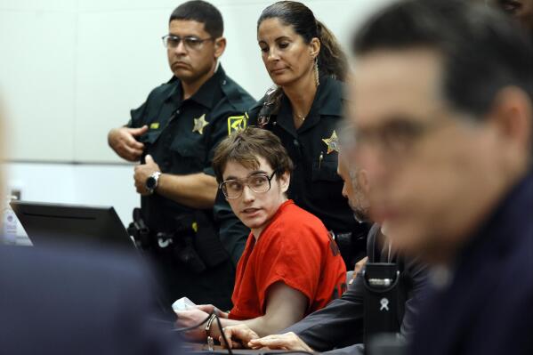 Parkland shooter Nikolas Cruz is escorted from the courtroom after his sentencing at the Broward County Courthouse in Fort Lauderdale, Fla., on Wednesday, Nov. 2, 2022. Cruz was sentenced to life in prison for murdering 17 people at Parkland's Marjory Stoneman Douglas High School more than four years ago. (Amy Beth Bennett/South Florida Sun Sentinel via AP, Pool)