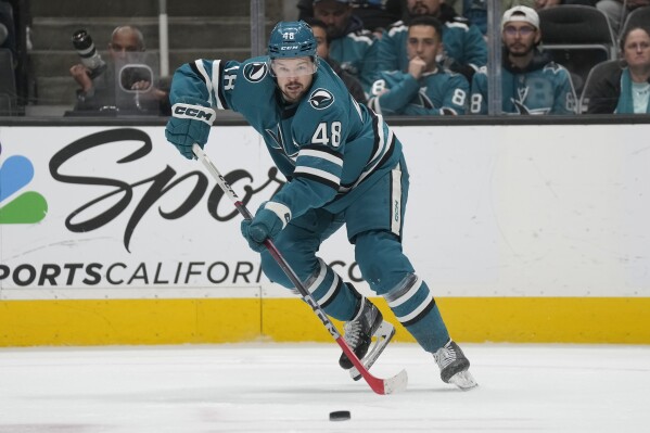 FILE San Jose Sharks center Tomas Hertl skates with the puck against the Los Angeles Kings during the second period of an NHL hockey game in San Jose, Calif., Tuesday, Dec. 19, 2023. The defending Stanley Cup champion Vegas Golden Knights acquired Hertl from San Jose in what so far stands as the biggest deal made on the final day of NHL trading, Friday, March 8, 2024.(AP Photo/Jeff Chiu, File)