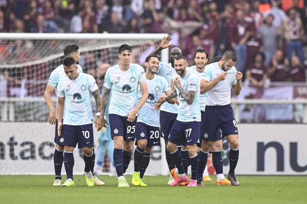 Inter's Marcelo Brozovic, third from right, celebrate with teammate after scoring his side's first goal during the Italian Serie A soccer match between Torino and Internazionale of Milan, at the Olympic Stadium in Turin, Italy, Saturday, June 3, 2023. (Fabio Ferrari/LaPresse via AP)