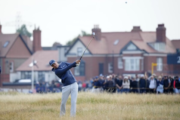 United States' Jordan Spieth plays from the rough on the 2nd hole on the first day of the British Open Golf Championships at the Royal Liverpool Golf Club in Hoylake, England, Thursday, July 20, 2023. (AP Photo/Jon Super)