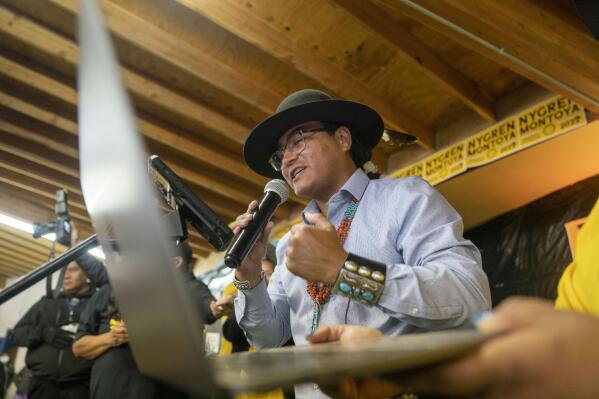 Buu Nygren announces his win for the Navajo Nation president as he reads tabulated votes from chapter houses across the reservation at his campaign's watch party at the Navajo Nation fairgrounds in Window Rock, Ariz., on Tuesday, Nov. 8, 2022. (AP Photo/William C. Weaver IV)