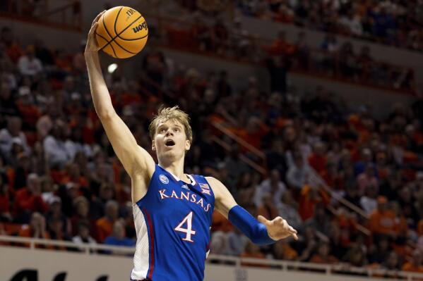 Kansas's Gradey Dick shoots a layup in the second half of an NCAA college basketball game against Oklahoma State in Stillwater, Okla., Tuesday, Feb. 14, 2023. (AP Photo/Mitch Alcala)