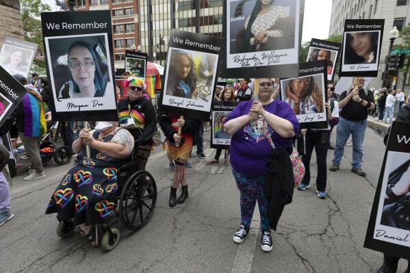 A group memorializing transgender people who died because of bias or hate in the U.S. marches in the Pride parade, Saturday, June 10, 2023, in Boston. The biggest Pride parade in New England returned on Saturday after a three-year hiatus, with a fresh focus on social justice and inclusion rather than corporate backing. (AP Photo/Michael Dwyer)