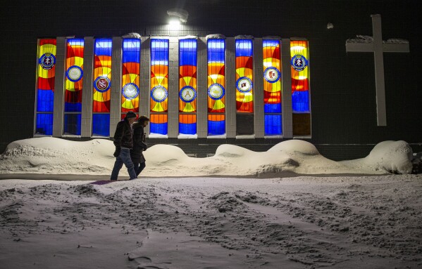 Kevin and Rebecca McCarville, of Cedar Rapids, walk in negative degree weather to participate in the caucus at the Salvation Army in Cedar Rapids, Iowa on Monday. (Savannah Blake/The Gazette via AP)