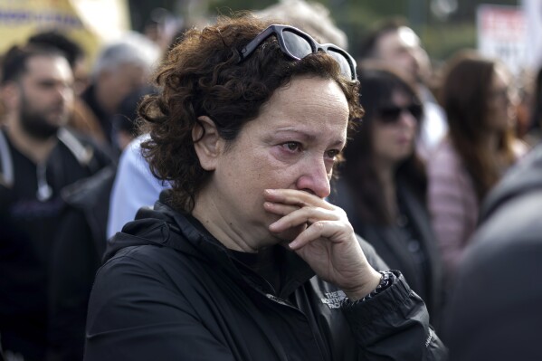 A woman reacts during a rally organised by the association of the families of victims of the Tempi train collision, which killed 57 people almost two years ago, at central Syntagma square, in Athens, Greece, Sunday, Jan. 26, 2025. (AP Photo/Yorgos Karahalis)