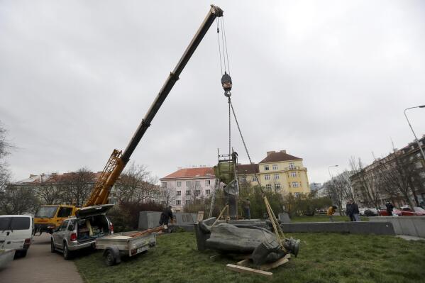 FILE - The statue of a Soviet World War II commander Marshall Ivan Stepanovic Konev is removed from its site in Prague, Czech Republic, April 3, 2020. The Czech capital has stripped a Soviet World War II commander of Prague honorary citizenship. Prague’s city assembly has on Thursday May 26, 2022 approved mayor Zdenek Hrib’s proposal to revoke Marshall Ivan Konev’s citizenship. (AP Photo/Petr David Josek)
