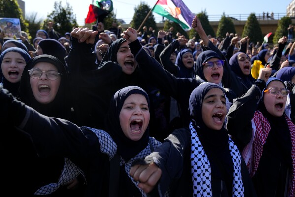 FILE - Lebanese students chant slogans during a protest, in front of the headquarters of U.N. Economic and Social Commission for Western Asia (ESCWA) in Beirut, Lebanon on Nov. 9, 2023. (AP Photo/Bilal Hussein, File)