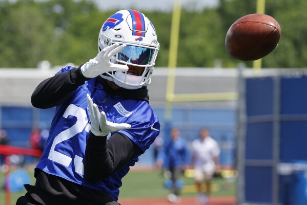 FILE -Buffalo Bills defensive back Micah Hyde (23) makes a catch during NFL football practice in Orchard Park, N.Y., Tuesday June 13, 2023. Micah Hyde’s season-ending neck injury and Jordan Poyer’s expiring contract provided the Buffalo Bills starting safety tandem a reminder their playing time together will one day come to an end. (AP Photo/Jeffrey T. Barnes, File)