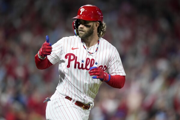 Philadelphia Phillies' Bryce Harper celebrates after a home run against the Arizona Diamondbacks during the =1- inning in Game 1 of the baseball NL Championship Series in Philadelphia, Monday, Oct. 16, 2023. (AP Photo/Matt Slocum)