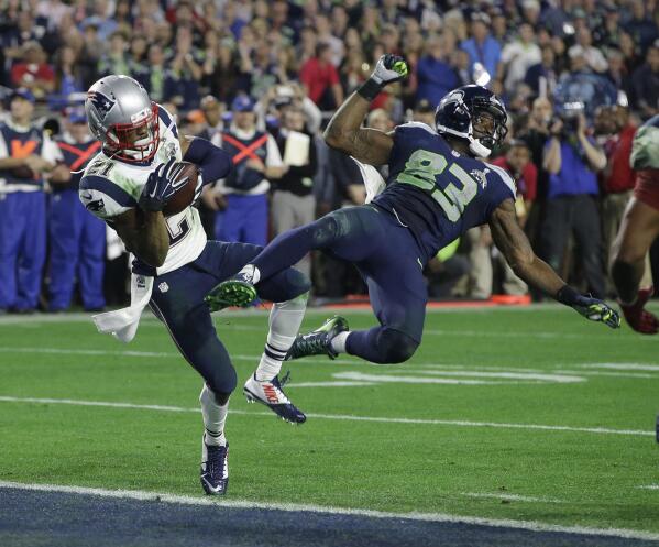 FILE - In this Feb. 1, 2015, file photo, New England Patriots cornerback Malcolm Butler (21) intercepts a pass intended for Seattle Seahawks wide receiver Ricardo Lockette during the NFL Super Bowl XLIX football game in Glendale, Ariz. The biggest moment in Malcolm Butler's career happened right here at State Farm Stadium, when the rookie cornerback stepped in front of a Seattle Seahawks receiver at the goalline, intercepted a Russell Wilson pass, and secured a stunning Super Bowl XLIX victory for the New England Patriots. That play was about 6 1/2 years ago. Butler — who is entering his first season with the Arizona Cardinals — is finding out that's an eternity in NFL time.(AP Photo/Kathy Willens, File)