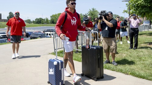 Kansas City Chiefs quarterback Patrick Mahomes wheels his belongings into a dorm room at Missouri Western State University during the first day of NFL football training camp on Tuesday, July 18, 2023, in St. Joseph, Mo. (Nick Wagner/The Kansas City Star via AP)