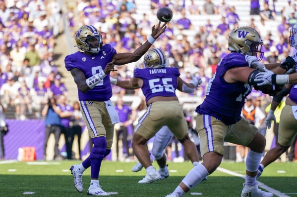 Washington quarterback Michael Penix Jr. (9) throws during the second half of the team's NCAA college football game against Boise State, Saturday, Sept. 2, 2023, in Seattle.(AP Photo/Lindsey Wasson)