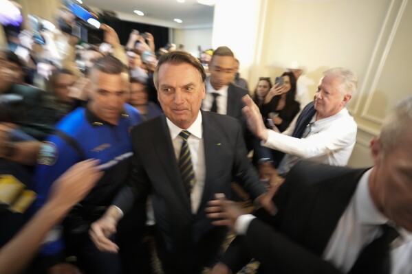 FILE - Brazil's former President Jair Bolsonaro leaves after attending an event at the Trump National Doral Miami, in Doral, Fla., Feb. 3, 2023. As Bolsonaro's term wound down in the final days of December 2022, Bolsonaro decided to skip the ritual of handing over the presidential sash to his successor, and instead traveled to Florida. (AP Photo/Rebecca Blackwell, File)