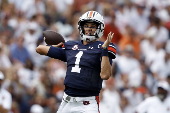 Auburn quarterback Payton Thorne throws a pass against Massachusetts during the first half of an NCAA college football game Saturday, Sept. 2, 2023, in Auburn, Ala. (AP Photo/Butch Dill)