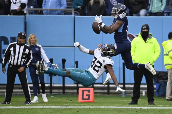 Tennessee Titans wide receiver Racey McMath, is unable to catch a pass in the end zone as Jacksonville Jaguars cornerback Tyson Campbell (32) defends during the second half of an NFL football game Sunday, Dec. 11, 2022, in Nashville, Tenn. (AP Photo/Mark Zaleski)