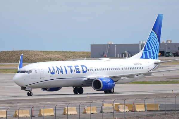 A United Airlines jetliner taxis at Denver International Airport Tuesday, April 16, 2024, in Denver. (AP Photo/David Zalubowski)