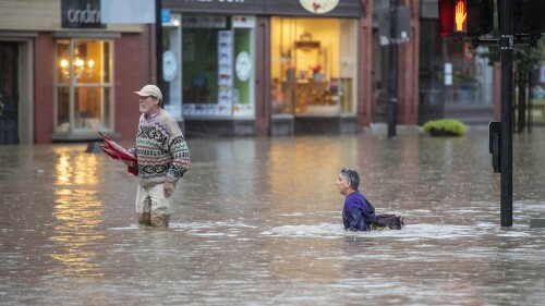 The Quirky Pet owner Cindra Conison, right, and her husband Richard Sheir leave their shop on Monday night, July 10, 2023, in downtown Montpelier, Vt. (Jeb Wallace-Brodeur/The Times Argus via AP)