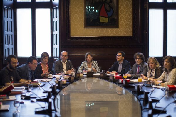 
              President of the Catalan parliament Carme Forcadell, center, attends a meeting with parliament representatives at the Catalonia Parliament in Barcelona, Spain, Wednesday, Oct. 4, 2017. Catalonia's regional government is mulling when to declare the region's independence from Spain in the wake of a disputed referendum that has triggered Spain's most serious national crisis in decades. (AP Photo/Emilio Morenatti)
            