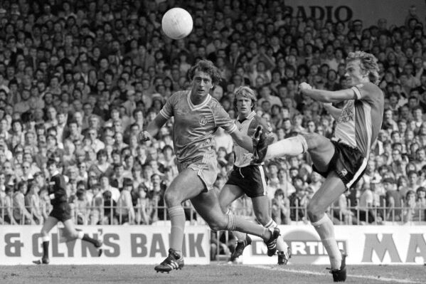 FILE - Soccer player Trevor Francis, centre, in action during a match, Nov. 3, 1981. Former England forward Trevor Francis has died it was reported on Monday, July 24, 2023. He was 69. Francis became Britain’s first £1 million ($12.8 million) footballer when he joined Nottingham Forest from Birmingham in 1979. (PA via AP, File)