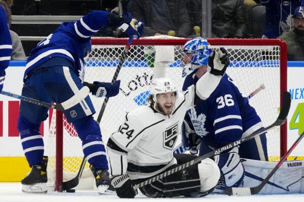 Los Angeles Kings left wing Phillip Danault (24) celebrates his goal as Toronto Maple Leafs goaltender Jack Campbell (36) looks on during the second period of an NHL hockey game, in Toronto, Monday, Nov. 8, 2021. (Frank Gunn/The Canadian Press via AP)