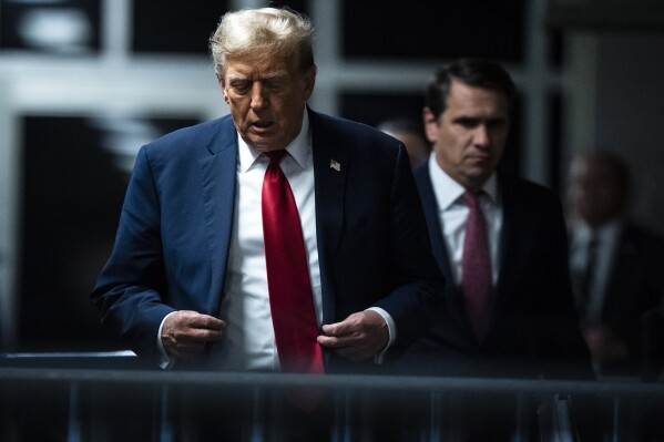 Former President Donald Trump walks out of the courtroom following the first day of jury selection for his trial at the Manhattan criminal court in New York, on Monday, April 15, 2024. (Jabin Botsford/The Washington Post via AP, Pool)