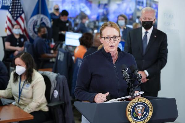 President Joe Biden listens as FEMA Administrator Deanne Criswell speaks at the National Response Coordination Center at FEMA headquarters, Sunday, Aug. 29, 2021, in Washington. (AP Photo/Manuel Balce Ceneta)