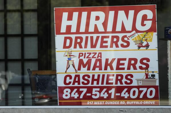 A hiring sign is displayed at a restaurant in Buffalo Grove, Ill., Wednesday, May 10, 2023. On Wednesday, the Labor Department reports on job openings and labor turnover for April. (AP Photo/Nam Y. Huh)